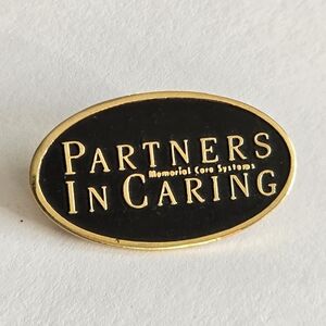 Partners in Caring lapel pin brooch black oval gold tone